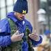 Omega Psi Phi Fraternity Incorporated member Dominique Green warms his hands after a step show at MLK on the Diag on Monday, Jan. 21. Daniel Brenner I AnnArbor.com